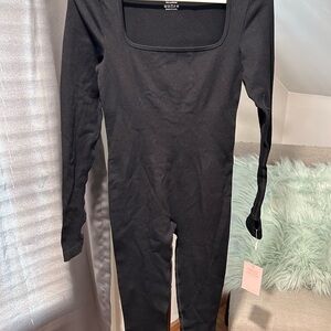 OQQ Black Long Sleeve Bodysuit